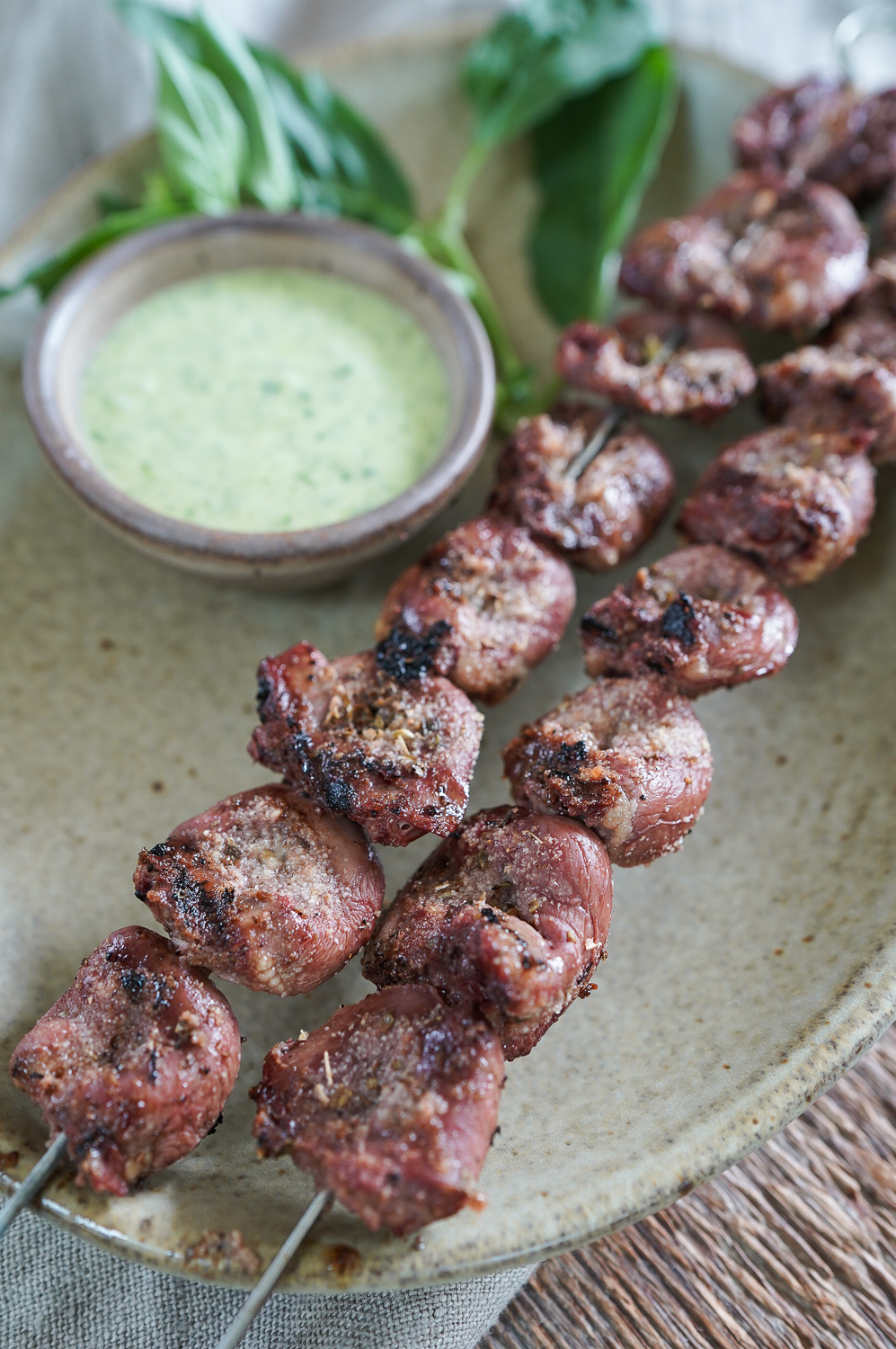 close up of grilled chicken hearts on skewer