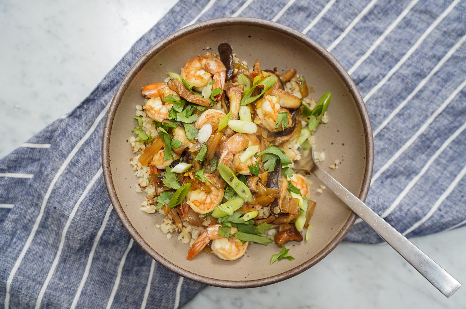 Cauliflower rice stir fry in bowl landscape